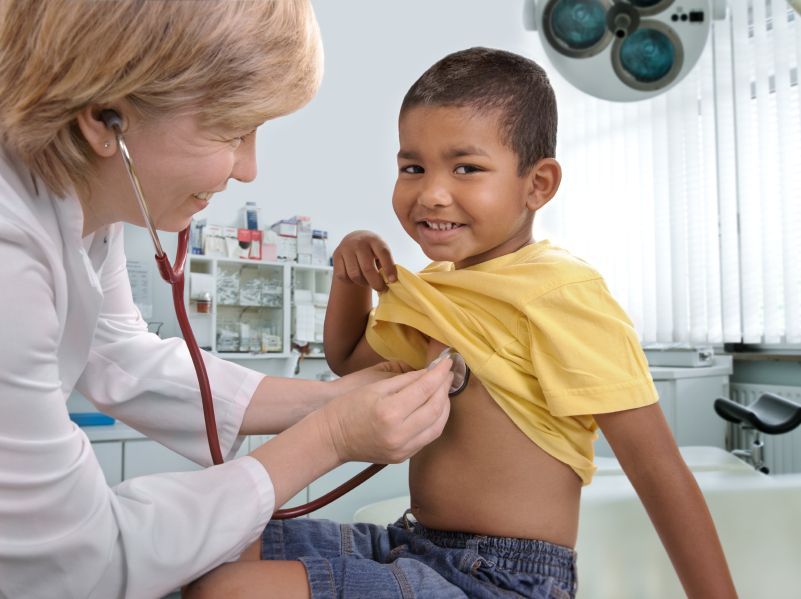 Image of doctor treating a child patient